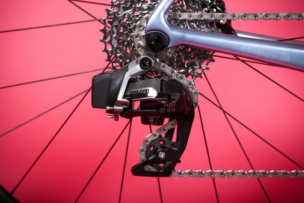 SRAM rival rear mech on a pink background