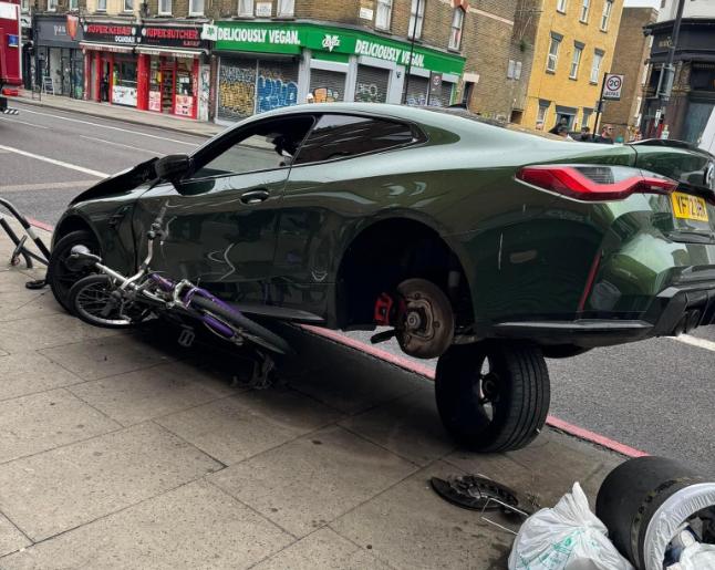 “That new dangerous cycling law can’t come soon enough”: BMW driver crashes spectacularly into bike stand on pavement, as cyclists ask, “when will Mark Harper do anything about this?”; Brand: “No regr