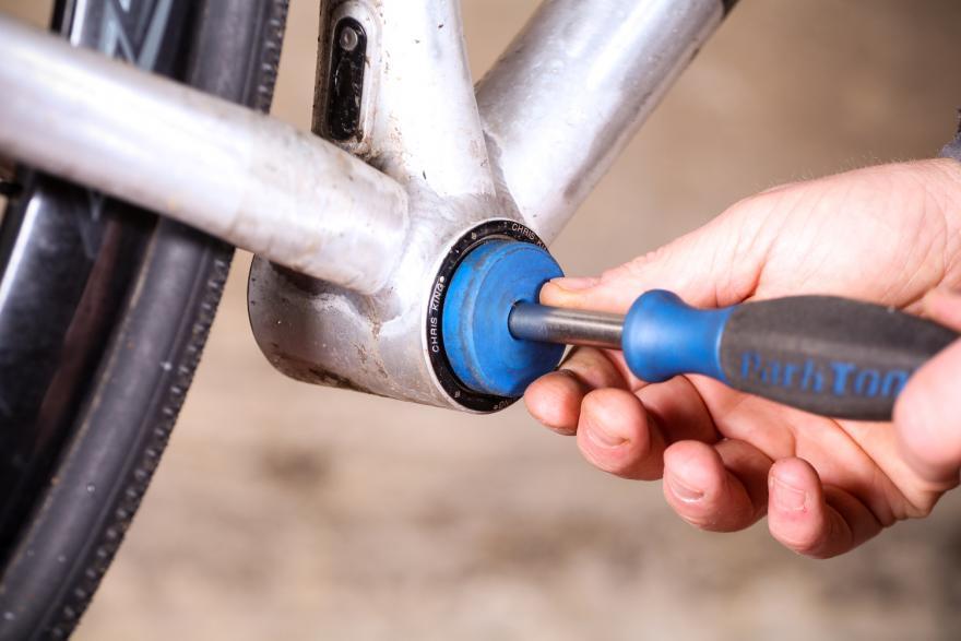 Installing press fit bottom store bracket in carbon frame