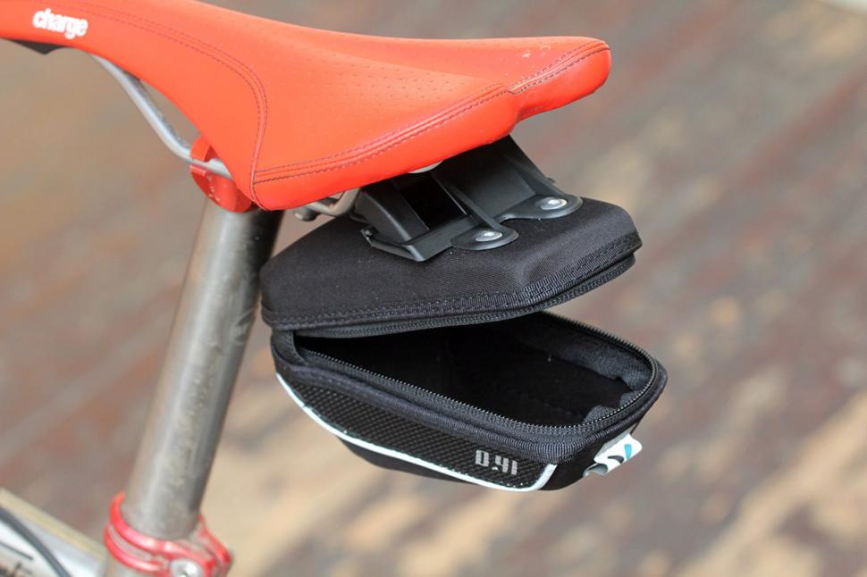 Lightweight Carbon and Large 10 Liter Capacity TriSeven Premium 10L Carbon Waterproof Saddle Bag Backpack Adjustable Velcro & Buckle Design for MTB/Road Cycling 