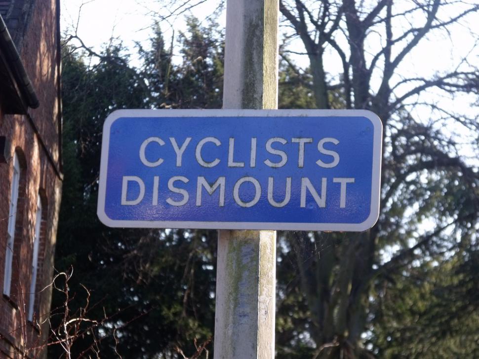 Cyclists Dismount (via Flickr user Elliott Brown)