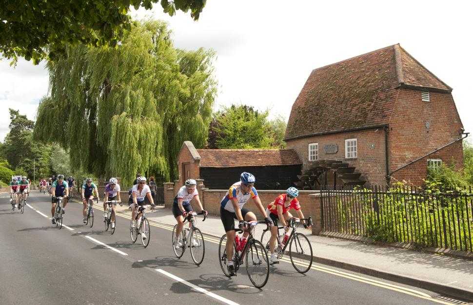 Prudential RideLondon-Surrey 100 - riders passing a mill