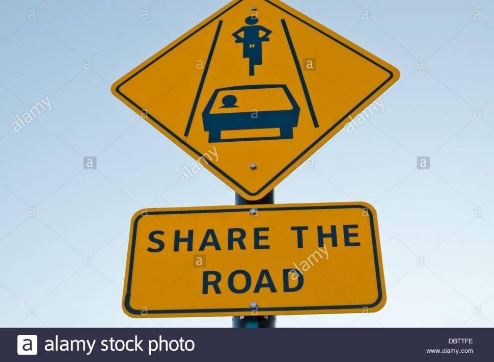 Dangerous turns, triangle warning traffic sign near rural road Stock Photo  - Alamy