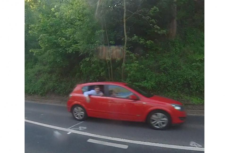 Car passenger throws rubbish at man cycling with his 4-year-old son