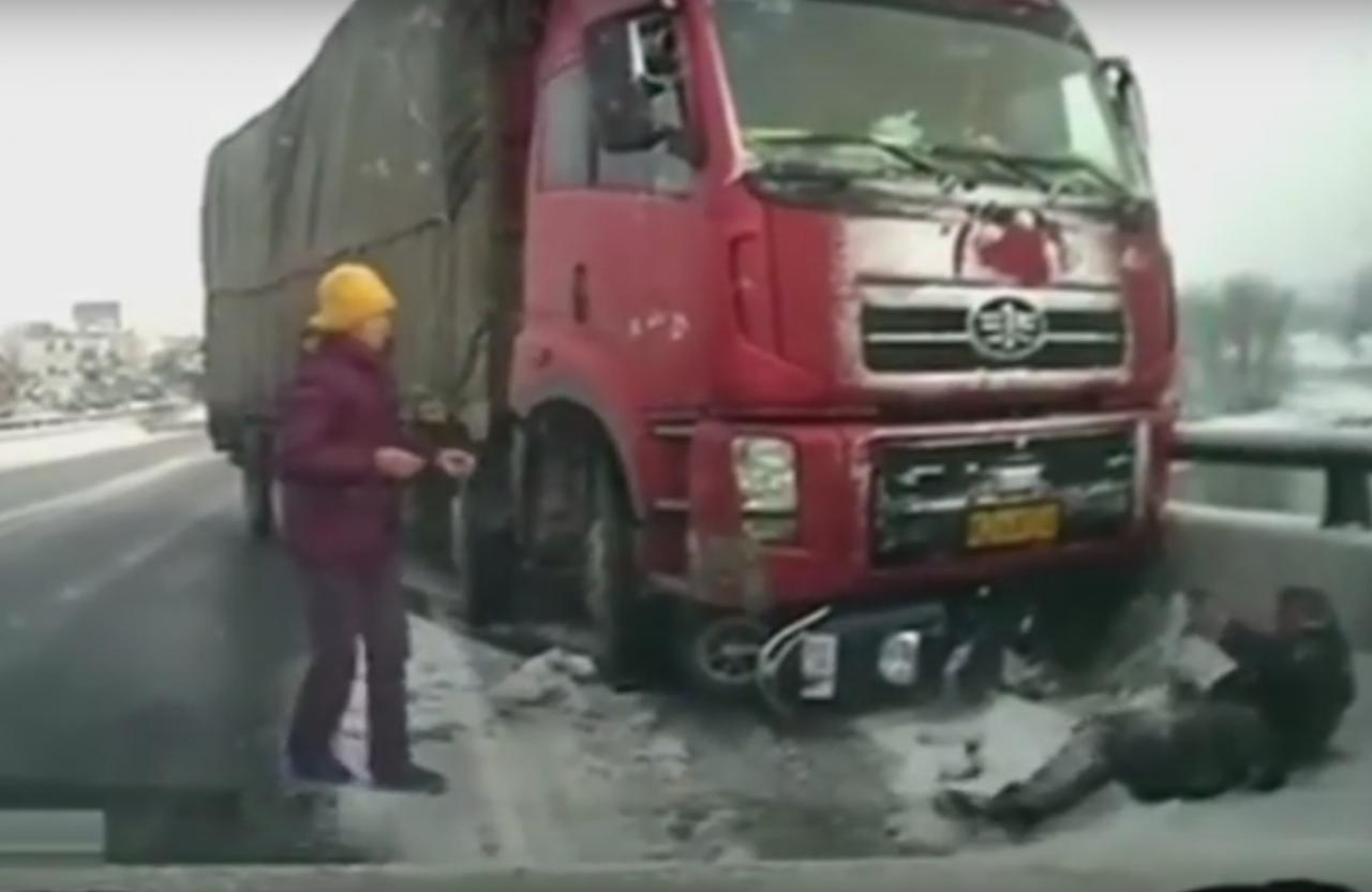 Video of overloaded truck teetering past pedestrians with inches to spare  in China