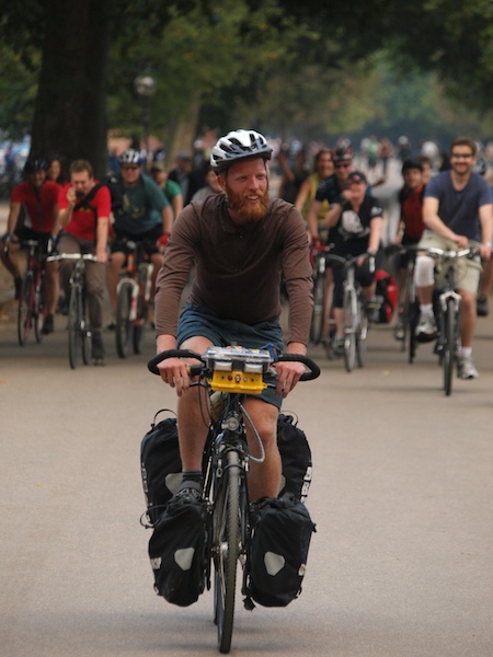 Cyclists escort James Bowthorpe into Hyde Park at the end of his record-breaking round-the-world trip