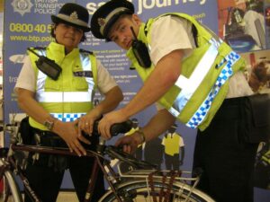 British Transport Police add security tags to a bike.JPG