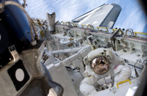 Tim Kopra undertaking a spacewalk at the International Space Station (picture credit NASA).jpg