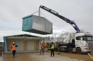 Middlesbrough Cycle Circuit clubhouse is hoisted into place (picture used courtesy of Middlesbrough Council).png