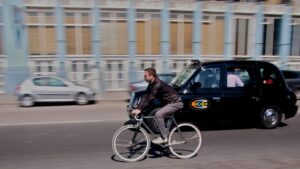 Taxi and Cyclist copyright Simon MacMichael.jpg