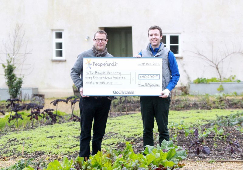 Bicycle-Academy-Andrew-Denham-receives-cheque-from-peoplefund.it-Hugh-Fearnley-Whittingstall