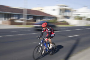 Cyclist on Beach Road, Melbourne (CC licensed on Flickr by sufw)