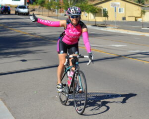 Female cyclist giving thumbs up (uploaded to Flickr under CC-BY-SA licence by Chris Hunkeler)