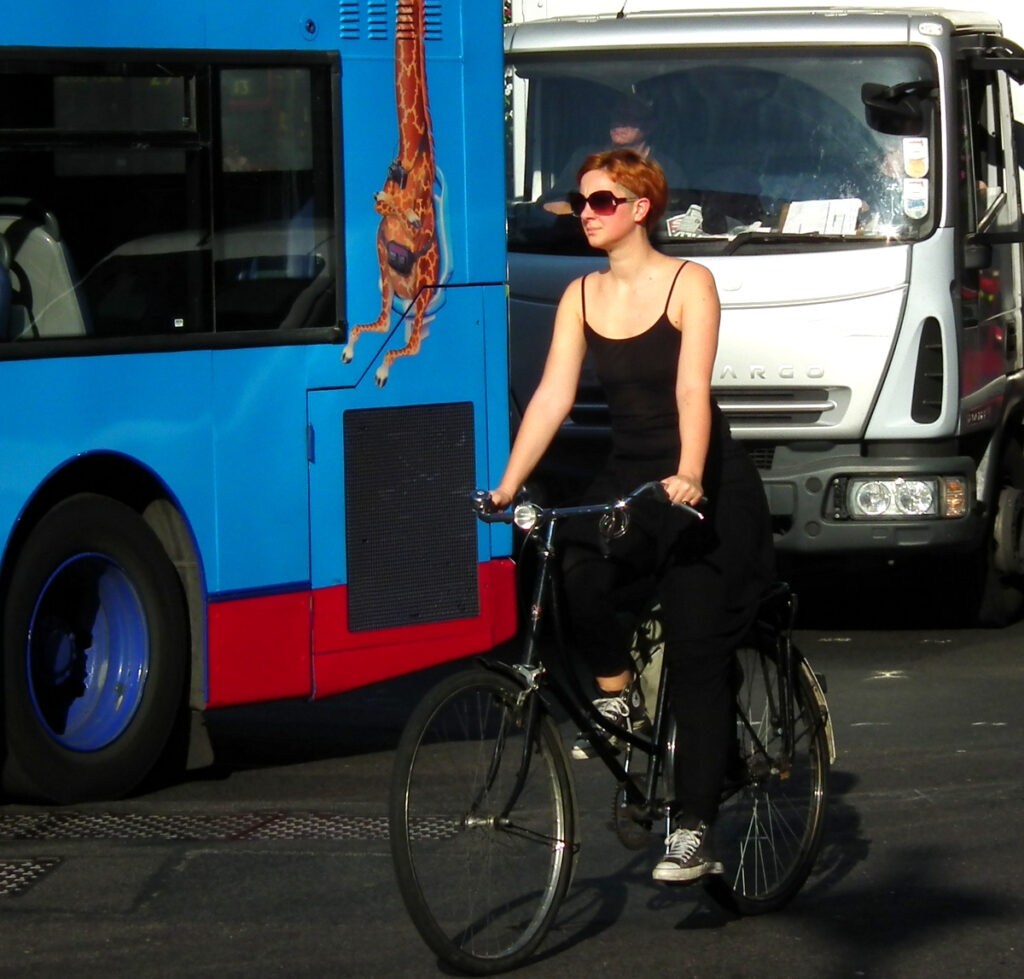 Woman on bike in London (CC licensed image by kenjonbro:Flickr)