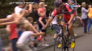 Marcus Burghradt gives his musette to a young fan
