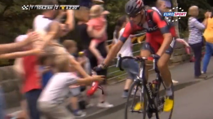 Marcus Burghradt gives his musette to a young fan