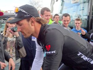 Fabian Cancellara riding bike without helmet (licensed CC BY SA 3.0 on Wikimedia Commons by Jeremy Jannick)
