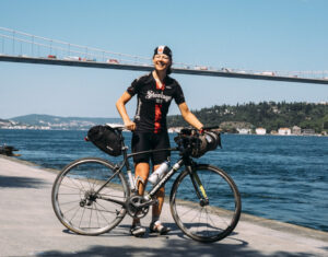 Pippa Handley poses in front of the Bosphorus Bridge after winning the women&rsquo;s category in the 2014 Continental Race (&copy;Matthias Wjst:TransContinental Race)