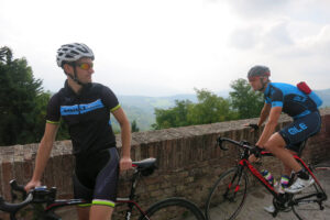 Italy Week Monday – Urbino Mat and Dave by the wall