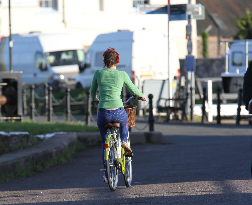 Cyclist with headphones (cc licensed by Adrian Midgley on Flickr)