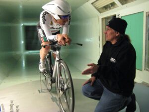 Steve Hed (right) discusses bike set up in his second home, the wind tunnel (image ©Hed Cycling)