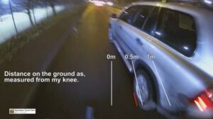 Still from Aberdeen Cycle Cam YouTube video of close pass