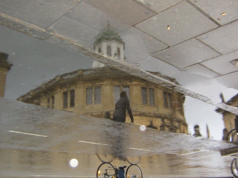 Bike passing Sheldonian Theatre, Oxford.jpg