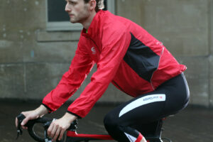 Optimum Stowaway Rain Jacket - on bike