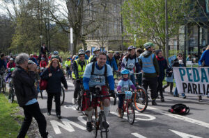 Dave Brennan (centre) at 2015 Pedal on Parliament (licensed by DarkerSide on Flickr under CC-BY-2.0)