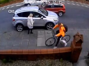 Still from CCTV footage of cyclist hitting toddler