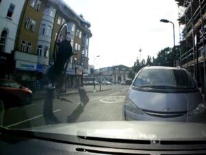 Cyclist somersaults after hitting pothole (still taken from London Evening Standard video)