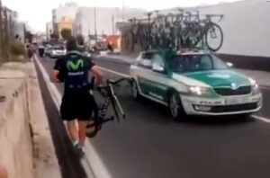 Movistar soigneur with broken bike