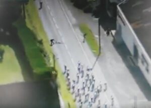 Still from video of spectator saving the GP de Fourmies peloton