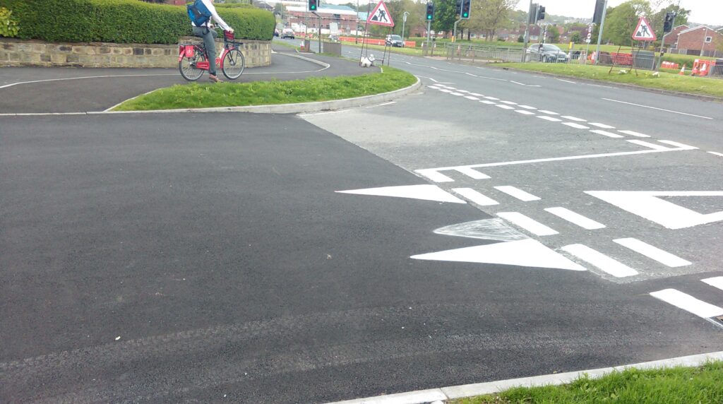 Leeds Bradford cycle superhighway give way at side street.jpg