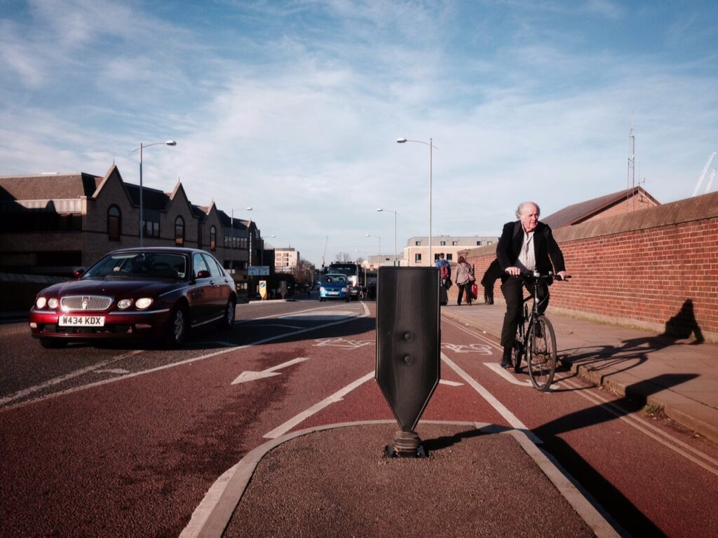 Cyclist on Hills Road Bridge in Cambridge (copyright Simon MacMichael).jpeg