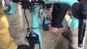 Commissaire checks LottoNL-Jumbo bike for motor video still.JPG