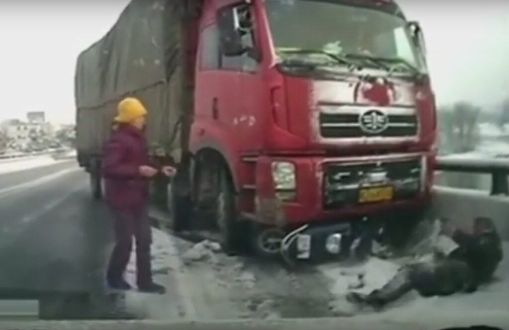 Cyclist hit by truck in China (taken from YouTube).jpg