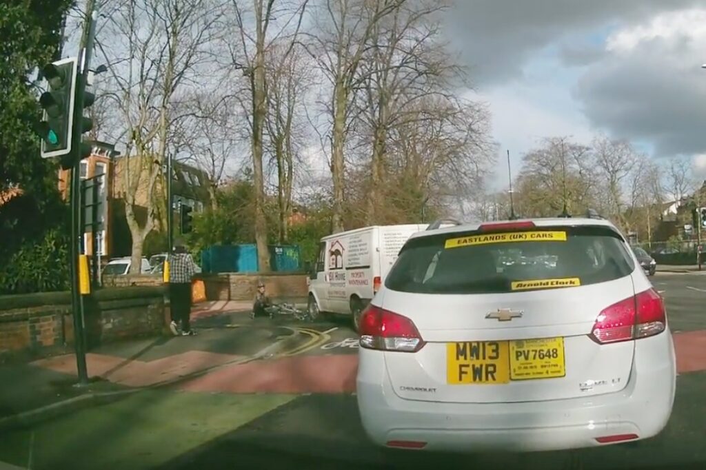 Cyclist hit by van on Wilmslow Road (taken from YouTube).jpg