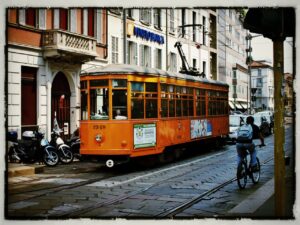 Milan cyclist and tram Copyright Simon MacMichael.jpg