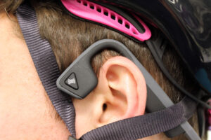 Aftershokz Trekz Titanium Bone Conduction Headphones - worn with helmet.jpg
