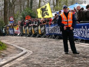 Tour of Flanders policeman (licensed CC BY 2.0 by Louise Ireland on Flickr).JPG