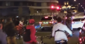 Police car hits cyclist.png