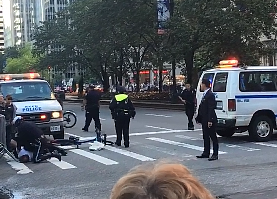 NYPD tackle cyclist as Obama motorcade approaches (source mattpeco Instagram video still).PNG