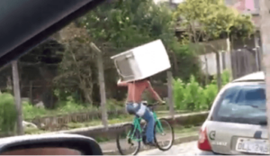 Brazil fridge cyclist (Luam Paim Facebook video still).PNG