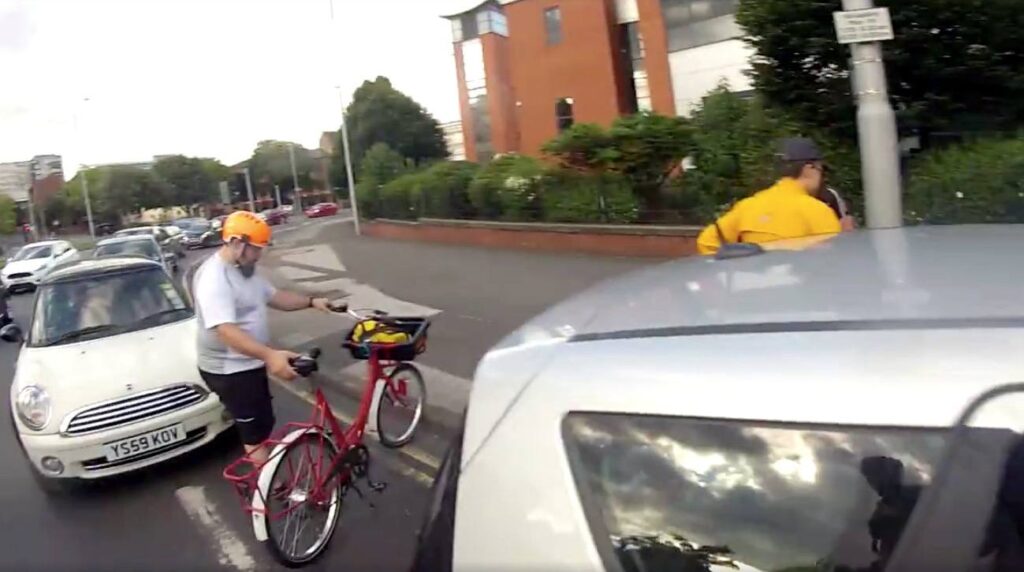 Nottingham Critical Mass cyclists gather to aid motorist.jpg