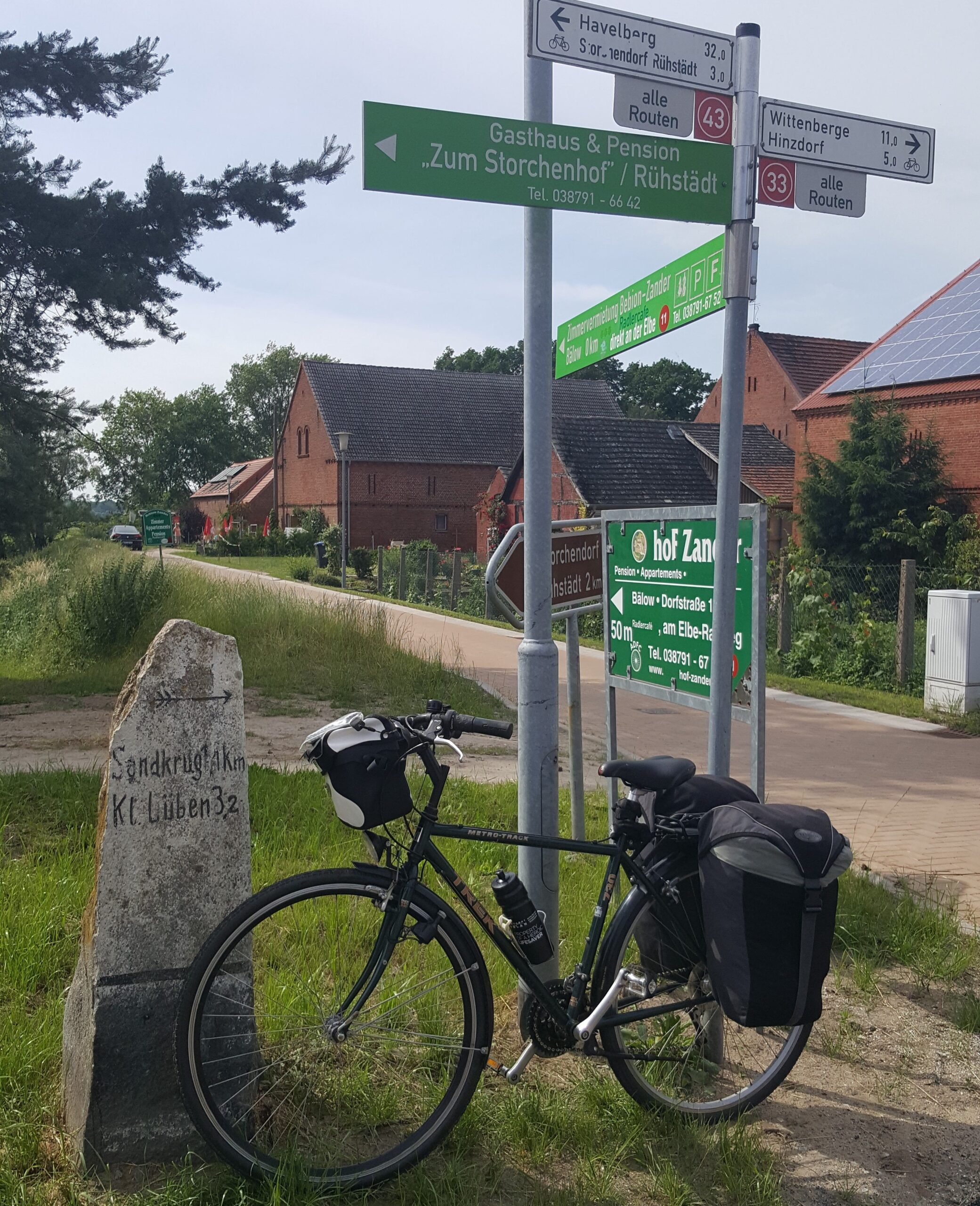 Bike on the side and signpost