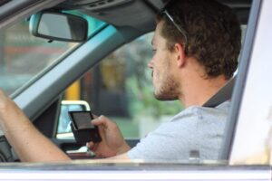 Phone use while driving – image CC licenced via Lord Jim.jpg