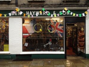 Ben Hayward & Son’s former Trumpington St premises decked out for Tour de France 2014 Stage 3 start in Cambridge (source Facebook).jpg