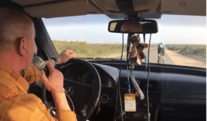 Cycling superfan gives 18km TT megaphone pep talk.png