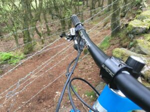 Barbed wire across mountain bike trail near Crewe (via Reddit).jpg